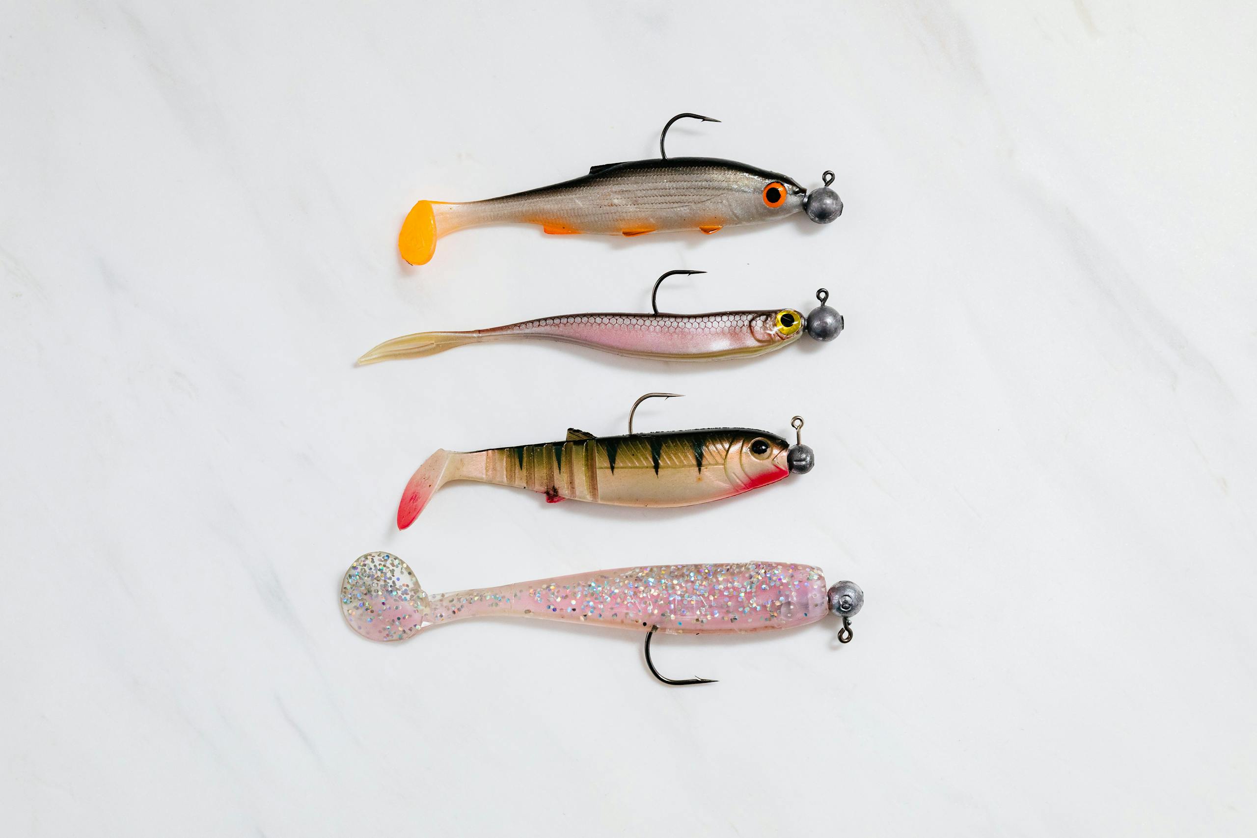 Four Various Fishing Baits on White Background